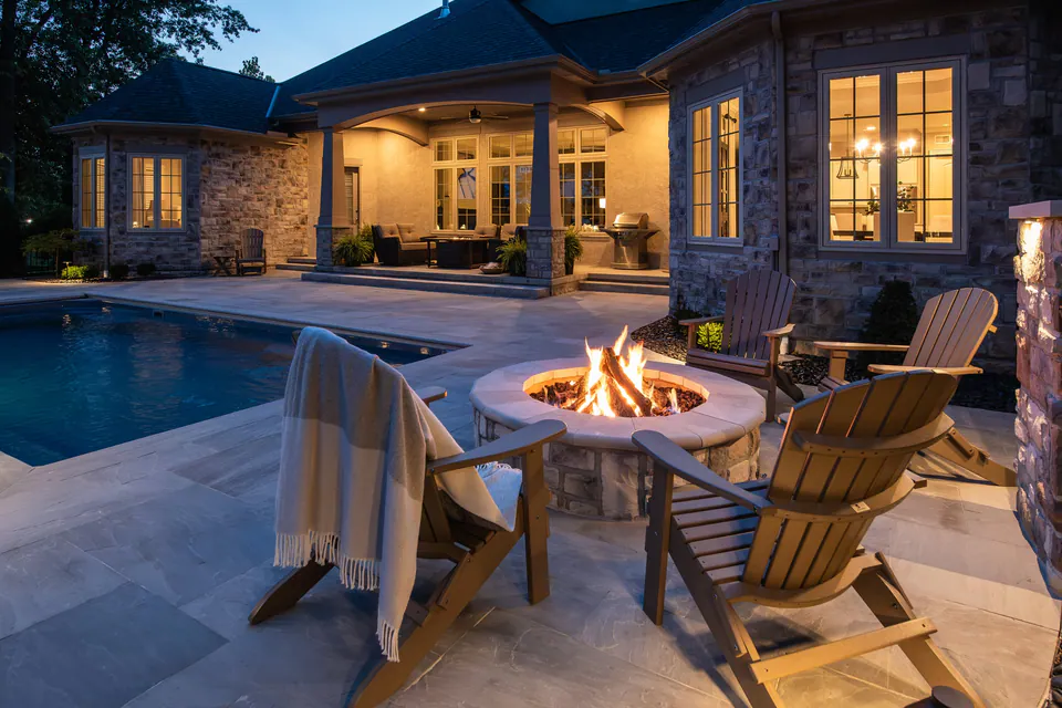 Finished poolside landscape edge with lighting and planting detail